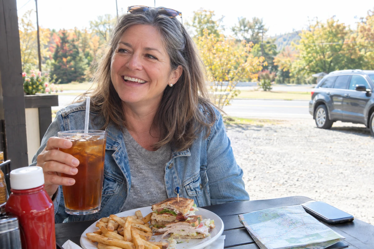 Real customer, 40–65, candid everyday moment (dinner, travel, out of the house)